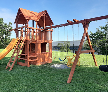 Woodplay square base playset installed in Davie, Florida by Play King.